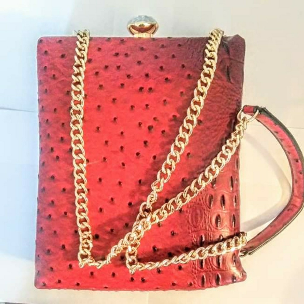Red and gold vegan leather purse.